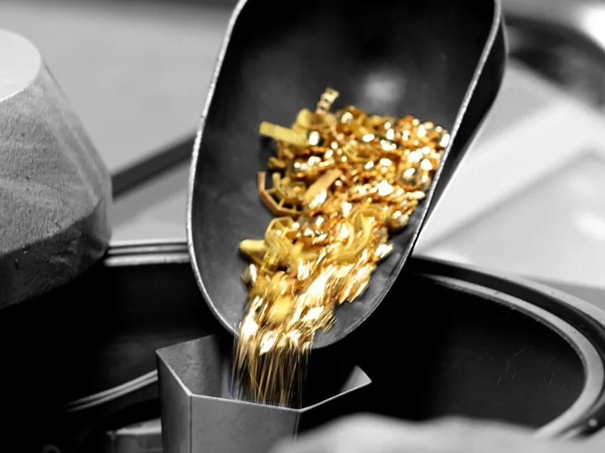 Gold being poured into a casting vessel
